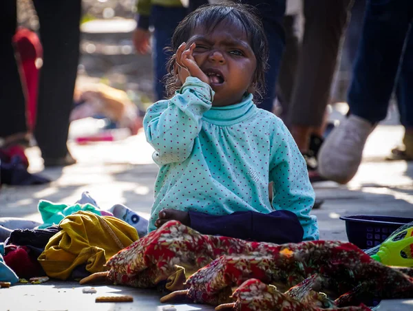 Stock image poor little girl in the market