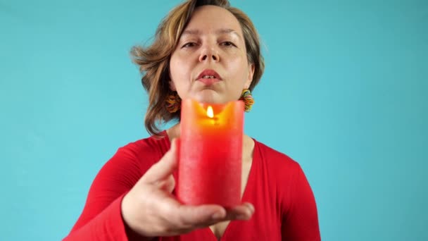 Woman Red Sweater Blows Out Red Candle Portrait Adult Woman — Vídeos de Stock