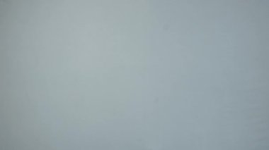 The background is grey. Slow motion texture gray