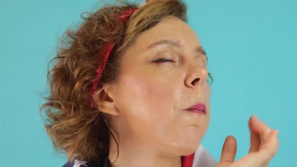 Forty Year Old Pin Woman Chews Beautifully Blue Background Portrait — Vídeo de Stock