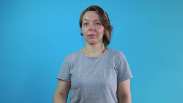 Adult Woman Gray Shirt Shows Dollars Euro Money Blue Isolated — Stok video