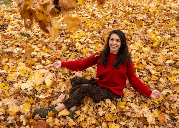Young Woman Red Sweater Sits Yellow Autumn Foliage Woman Throws —  Fotos de Stock