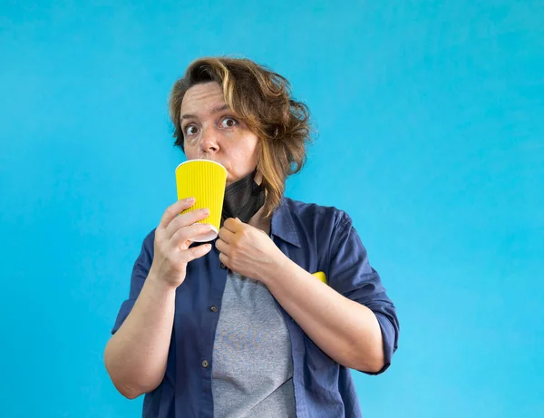 Woman Takes Black Medical Mask Drinks Coffee Yellow Glass Blue — Fotografia de Stock