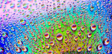 background of colorful water drops, closeup