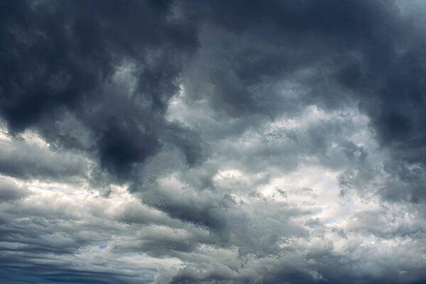 Summertime storm clouds loom overhead threatening rain and storms