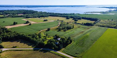 In rural wisconsin on a summer day - a view of Lake Winneconnie and rural famrs