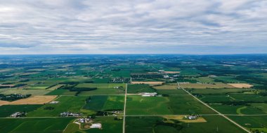 A view of the countryside of wisconsin during the summer with country roads and farms