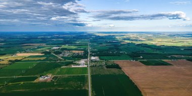 A view of the countryside of wisconsin during the summer with country roads and farms