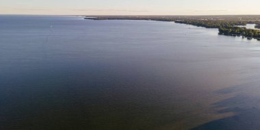 The summer shore of lake winnebago in rural wisconsin during the summertime