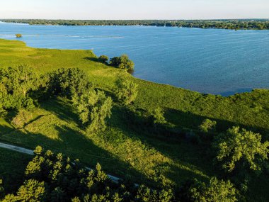 Summertime view of the shore along the fox river near oshkosh in wisconsin