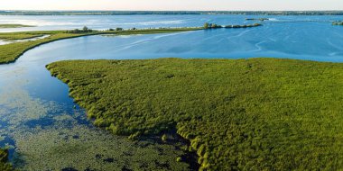Summertime view of the shore along the fox river near oshkosh in wisconsin