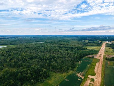 A view of a new highway being built near central wisconsin - open wilderness around