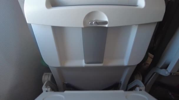 Closing your tray table before takeoff and landing. Stowing your tray table. — Stock Video