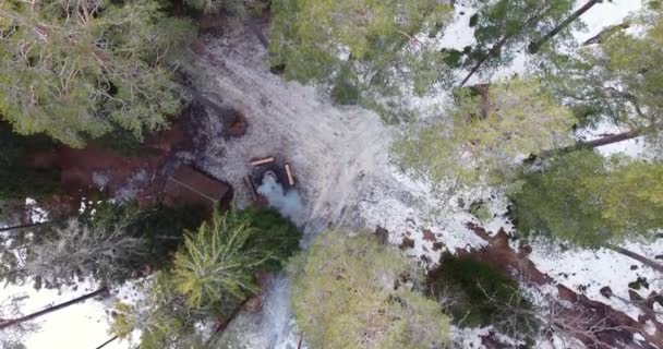 Aerial Drone Footage Flying Winter Forest Overlooking Cabin Woods Bonfire — Vídeos de Stock