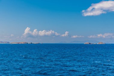 Paros island view and panorama from a ship on a beautiful colorful day, Cyclades, Aegean sea, Greece