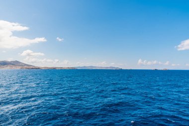 Paros island view and panorama from a ship on a beautiful colorful day, Cyclades, Aegean sea, Greece