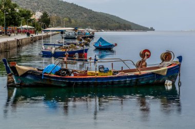 Fishing vessels in the port of Amfilochia on a cloudy day, very colorful, Aetolocarnania, Greece