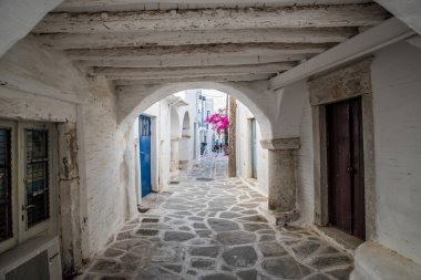 Traditional alley at Paroikia of Paros on a colorful day, Cyclades, Aegean, Greece