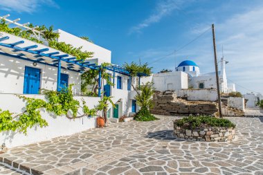 Traditional alley at Paroikia of Paros on a colorful day, Cyclades, Aegean, Greece