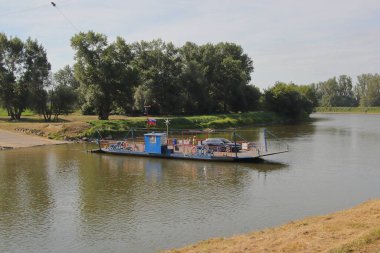 The river ferry for cars across the Morava River between municipalities Angern an der March (Austria) - Zhorsk Ves (Slovakia)