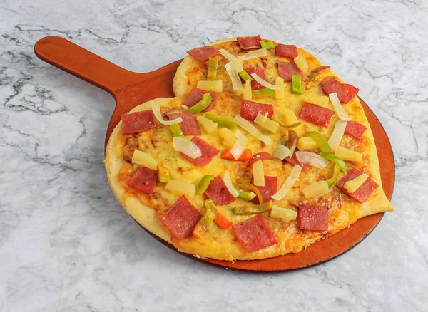 Heart Hawaiian valentine pizza with melting cheese tomatoes ham for Valentine\'s day with ingredients top view fast food