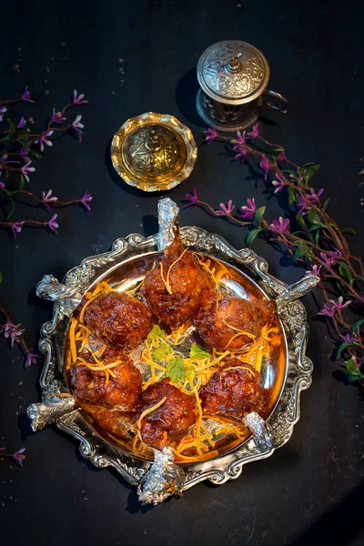 Chicken Drumstick or chicken lollipops platter served in dish isolated on dark background top view