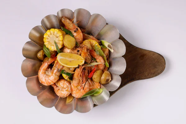 BUTTER GARLIC SHRIMPS BUCKET in a dish top view on grey background singapore food