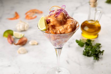 DYNAMITE SHRIMP served in a goblet isolated on wooden table background side view of appetizer