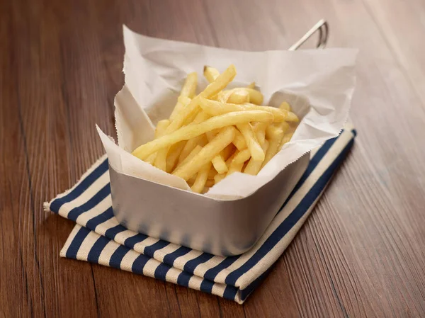Crispy French Fries Dish Isolated Napkin Dark Wooden Table Side — Fotografia de Stock