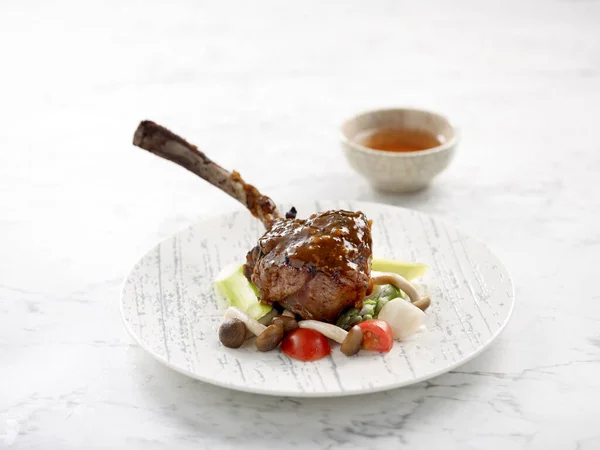 Baked Lamb Rack Red Wine Reduction Garnished Garden Greens Served — Stock Photo, Image