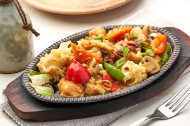 Chicken Sizzler served in a dish isolated on grey background side view of fastfood