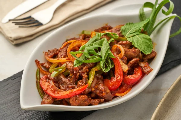 Beef Chilly Dry served in a dish isolated on grey background side view of fastfood