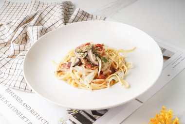 Carbonara Spaghetti pasta served in a dish isolated on wooden table side view
