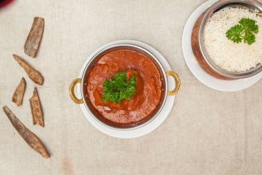 Beef vindaloo with plain rice served in a dish isolated on table top view of indian spices food