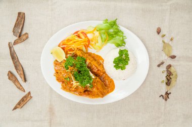 Mutton Rara gosth with plain rice, salad and lime served in a dish isolated on table top view of indian spices food