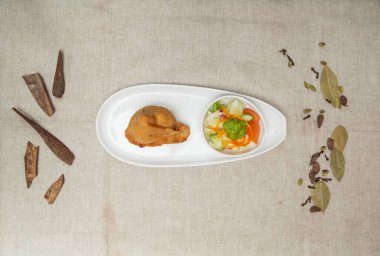 Samosa with chutey, sauce and salad served in a dish isolated on table top view of indian spices food