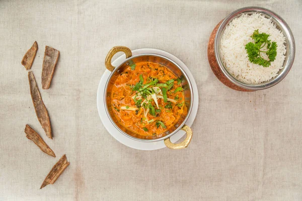 Mughlai chicken tikka masala with plain rice served in a dish isolated on table top view of indian spices food