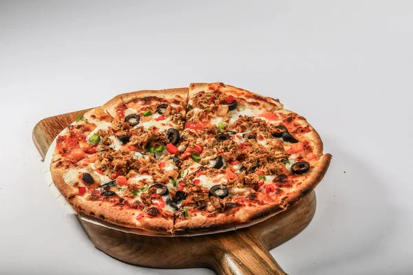 CHICKEN PIZZA topping with olive, chicken, tomato served in a cutting board isolated on grey background top view of arabian fastfood