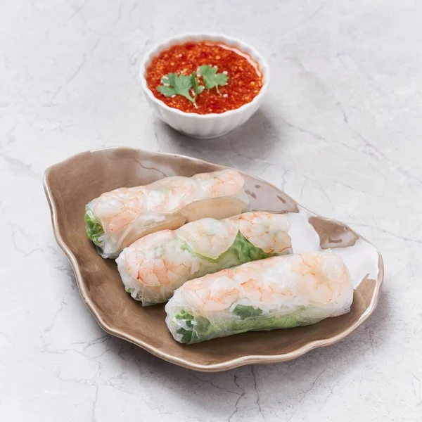 Fresh Spring Rolls with chili sauce served in a dish isolated on grey background side view of vietnam food