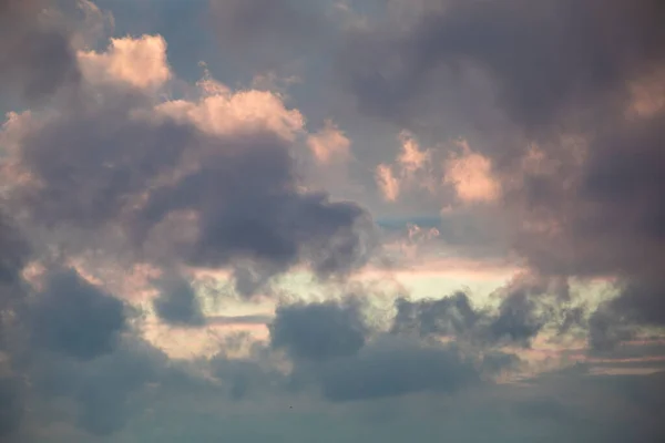 Dark sky background with dramatic thunder clouds and sunlight, sky background