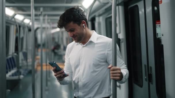 Businessman using smartphone in train — Stock Video