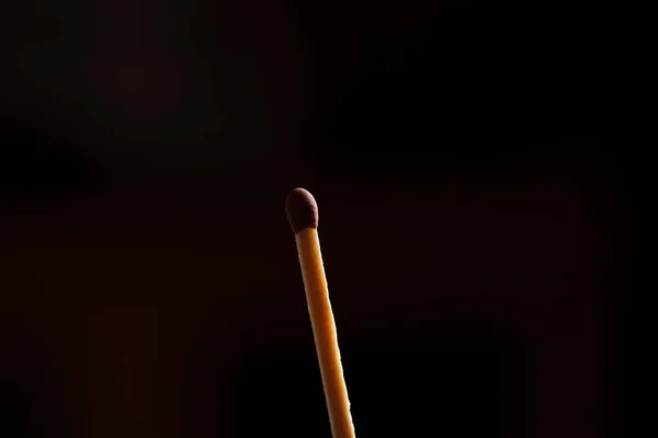 Brown match on black background — Stock Photo, Image