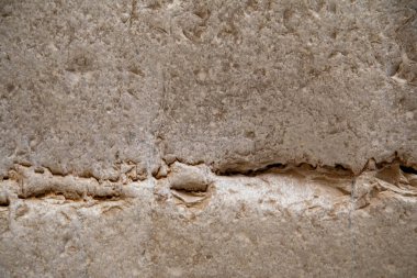 Soyut doğa dokusu. Kaya yüzeyi ya da bej dağ. Doğal malzeme geçmişi. Kaya tırmanışı arka planı, kopyalama alanı. Yüksek kalite fotoğraf
