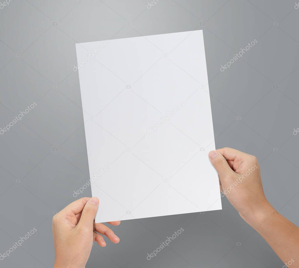 Hands holding paper blank a4 size for letter paper.