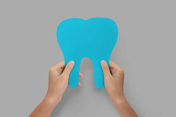 Hands Holding Blue Tooth Isolated Teeth Care Protection Concept ストックフォト