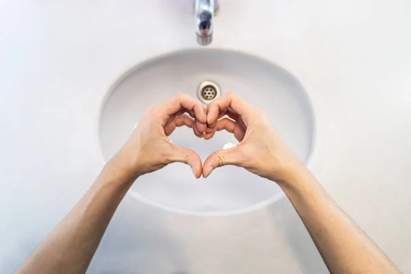 Close Woman Hands Made Heart Shaped Sinks Top View ロイヤリティフリーのストック画像