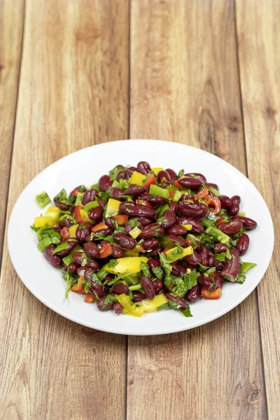 Mexican Bean Salad. Homemade black bean served in a ceramic plate, selective focus