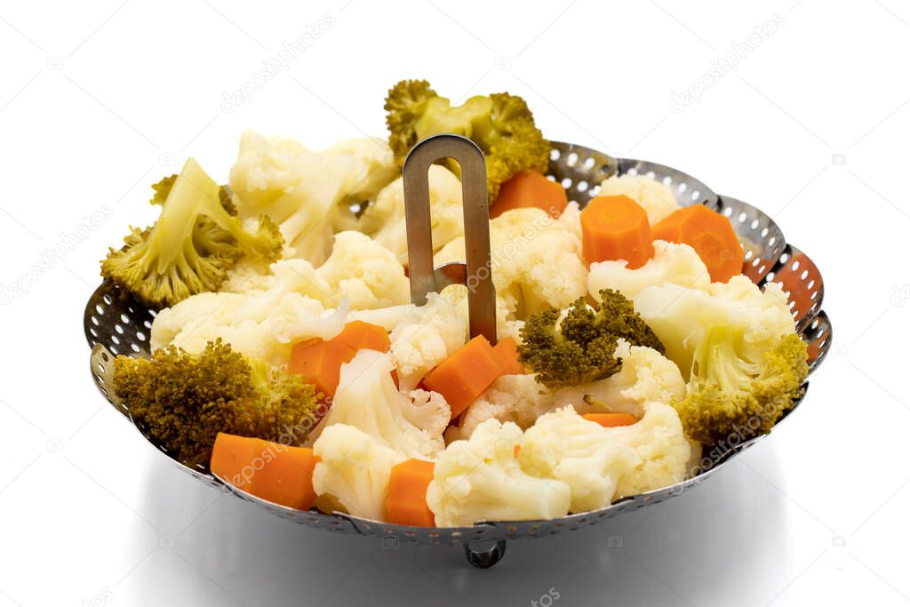 Steamed cauliflower, broccoli and carrots. Healthy eating. Close-up.