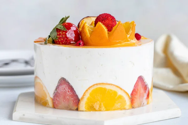 Fruit Parfait Cake on a white background. Fruit cake with white cream. Close-up. Horizontal view