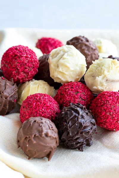 stock image Truffle chocolate assortment on a white background. homemade chocolate pralines. close up